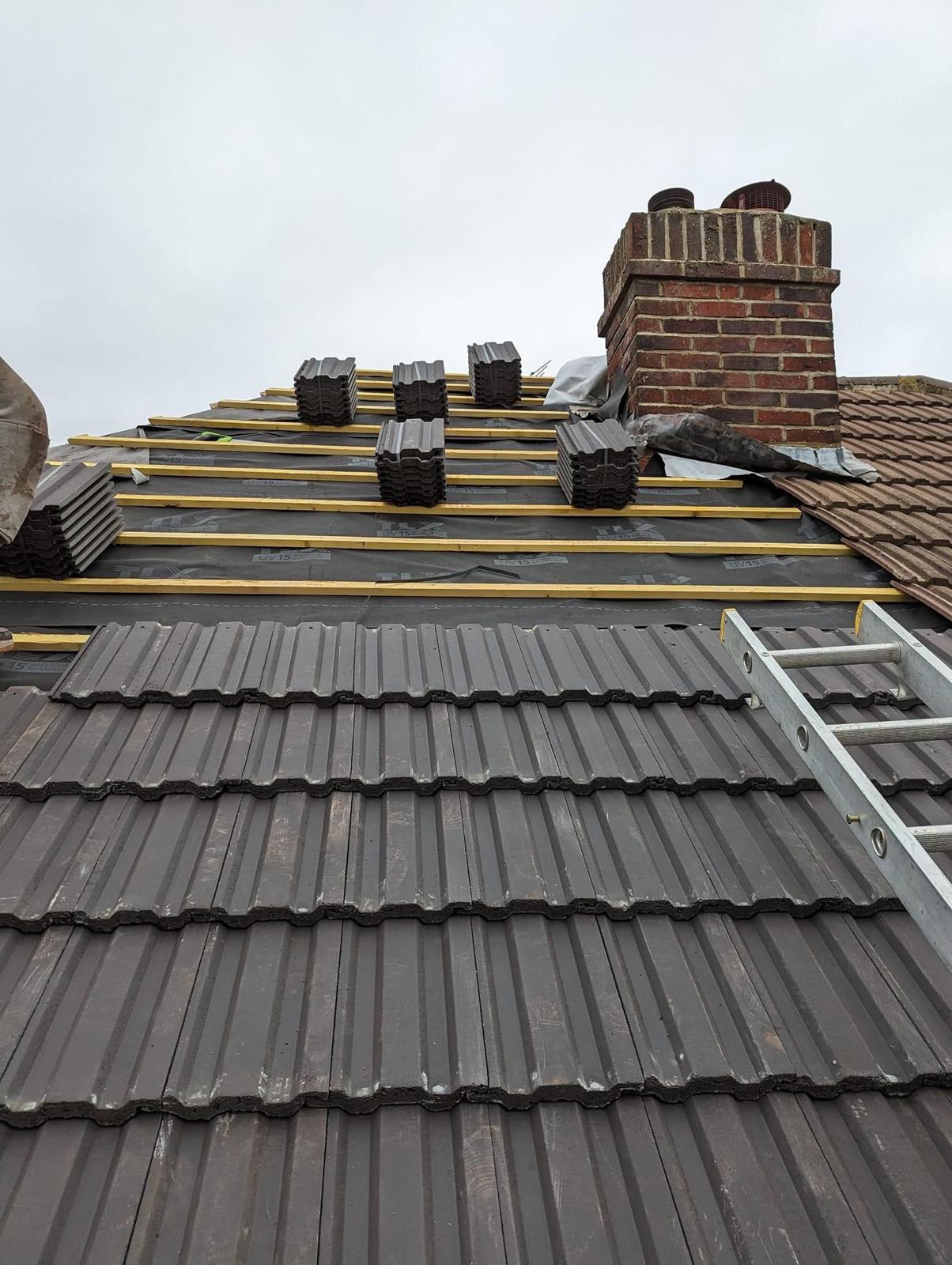 Newly installed grey tiled roof on an Edinburgh home